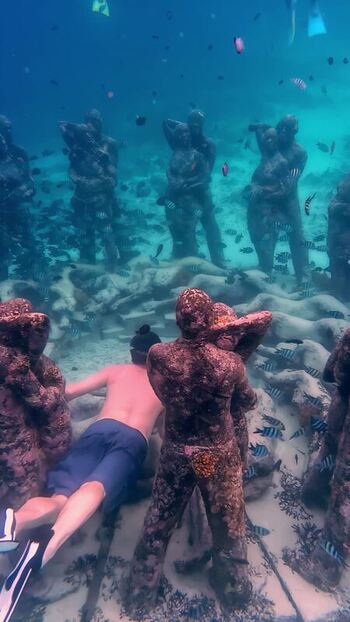 View of underwater sculptures with a swimmer in Bali Indonesia. View of underwater sculptures with a swimmer in Bali Indonesia.