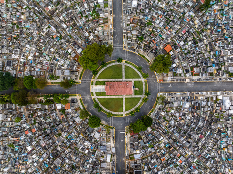 Aerial view of the circular layout of Maximo Gomez National Cemetery with its central building dense rows of graves and greenery in Santo Domingo Distrito Nacional Dominican Republic. Aerial view of the circular layout of Maximo Gomez National Cemetery with its central building dense rows of graves and greenery in Santo Domingo Distrito Nacional Dominican Republic.