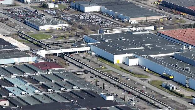 Aerial view of industrial buildings and car parks France.