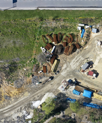 Aerial view of bundles of steel rebar construction materials and dirt tracks on a building site Avcilar Istanbul Turkiye. Aerial view of bundles of steel rebar construction materials and dirt tracks on a building site Avcilar Istanbul Turkiye.