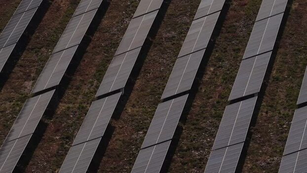 Aerial view of solar panels in rows on a field Portugal. Aerial view of solar panels in rows on a field Portugal.