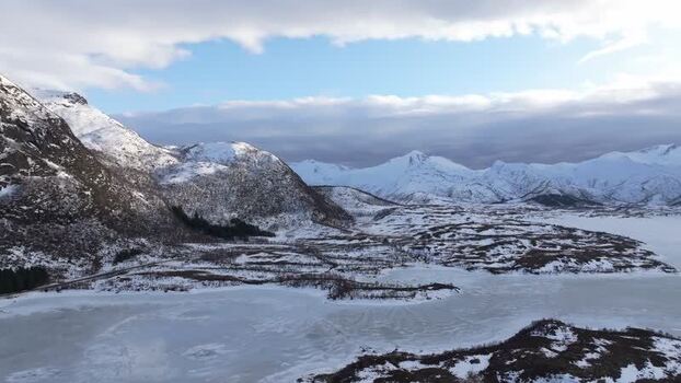 Aerial view of snowy Lofoten mountains in winter Norway.