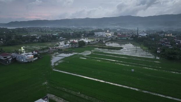 Aerial view of rice fields and town in Pacitan Indonesia. Aerial view of rice fields and town in Pacitan Indonesia.
