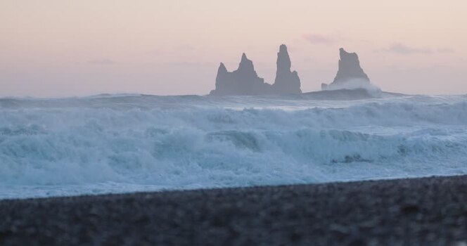 View of Reynisdrangar sea stacks in Iceland. View of Reynisdrangar sea stacks in Iceland.