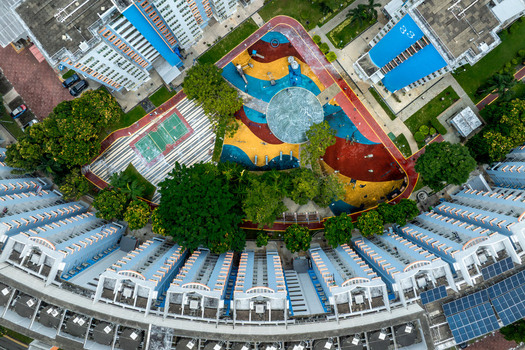 Aerial view of Boon Keng playground surrounded by residential apartment blocks with colorful ground patterns and lush trees in Singapore Bendemeer Road Singapore. Aerial view of Boon Keng playground surrounded by residential apartment blocks with colorful ground patterns and lush trees in Singapore Bendemeer Road Singapore.