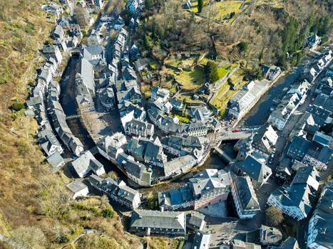 Aerial view of the historic old town with traditional half timbered houses and the winding Rur river nestled in a valley in Monschau North Rhine Westphalia Germany.