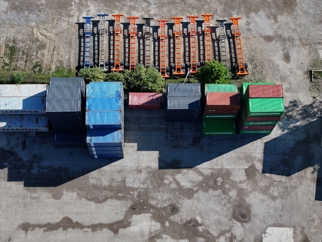 Aerial view of colorful shipping containers and trailer chassis parked in an industrial logistics yard Cincinnati OH United States.