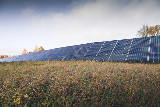 View of a large solar panel array installed in a grassy field under a cloudy sky in Otepaa Valga County Estonia. View of a large solar panel array installed in a grassy field under a cloudy sky in Otepaa Valga County Estonia.