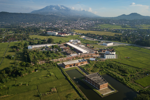 Aerial view of Benteng Fort Willem I a historic colonial fortress surrounded by lush green rice fields and the urban landscape of Ambarawa Central Java Indonesia. Aerial view of Benteng Fort Willem I a historic colonial fortress surrounded by lush green rice fields and the urban landscape of Ambarawa Central Java Indonesia.