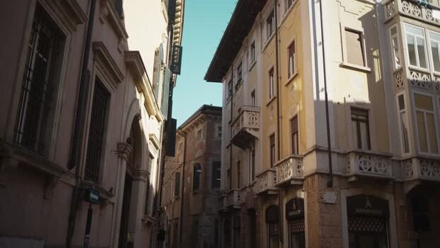 View of historic buildings in a narrow street in Verona Italy. View of historic buildings in a narrow street in Verona Italy.