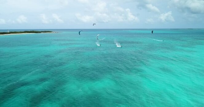 Aerial view of kitesurfers in Los Roques archipelago Venezuela.
