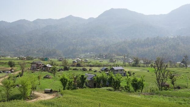 View of rural houses and green fields in the mountains Nepal.