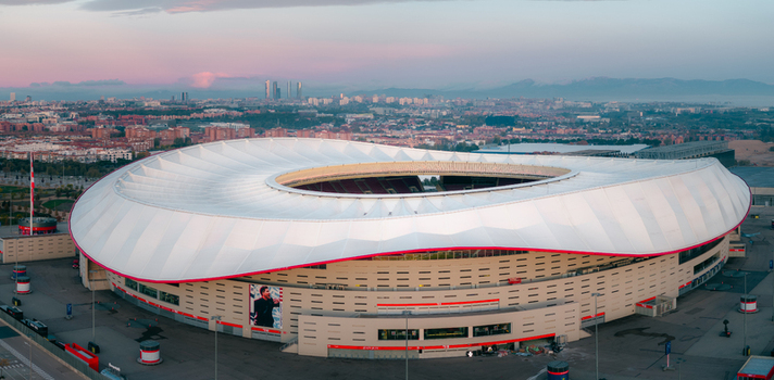 Aerial view of Riyadh Air Metropolitano Stadium with its distinctive white roof and modern architecture surrounded by the urban landscape of Madrid Comunidad de Madrid Spain.