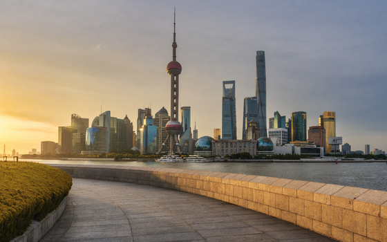 View of the Oriental Pearl Tower and the modern Lujiazui skyline across the Huangpu River at sunset Shanghai Shanghai China. View of the Oriental Pearl Tower and the modern Lujiazui skyline across the Huangpu River at sunset Shanghai Shanghai China.