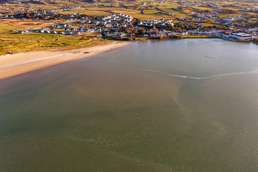 Aerial view of the sandy beach and coastal town of Dunfanaghy along the shores of Sheephaven Bay in County Donegal Ireland. Aerial view of the sandy beach and coastal town of Dunfanaghy along the shores of Sheephaven Bay in County Donegal Ireland.