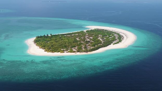 Aerial view of a tropical island with white sand beaches Maldives. Aerial view of a tropical island with white sand beaches Maldives.