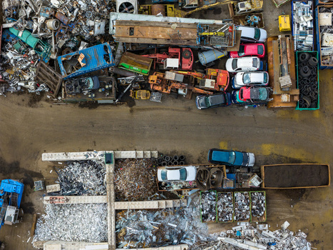 Aerial view of scrapped cars and crushed metal debris piled in a junkyard and recycling site in Hoogeveen Drenthe Netherlands. Aerial view of scrapped cars and crushed metal debris piled in a junkyard and recycling site in Hoogeveen Drenthe Netherlands.