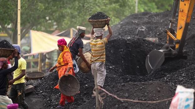 View of workers carrying coal baskets in Aminbazar Bangladesh.