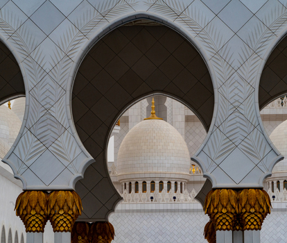 View of the ornate white marble arches and floral patterns of the Sheikh Zayed Grand Mosque Abu Dhabi Abu Dhabi United Arab Emirates. View of the ornate white marble arches and floral patterns of the Sheikh Zayed Grand Mosque Abu Dhabi Abu Dhabi United Arab Emirates.