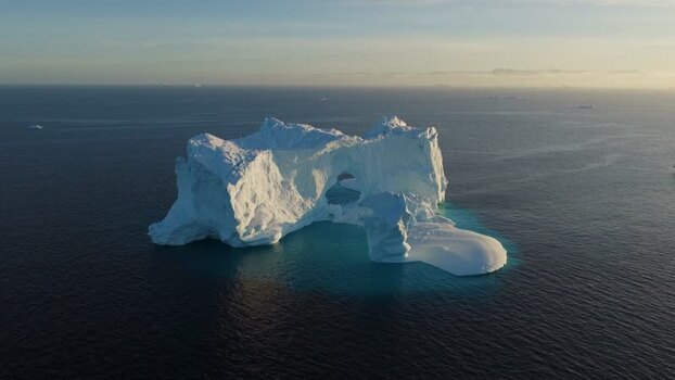 Aerial view of arch iceberg in the ocean Greenland. Aerial view of arch iceberg in the ocean Greenland.