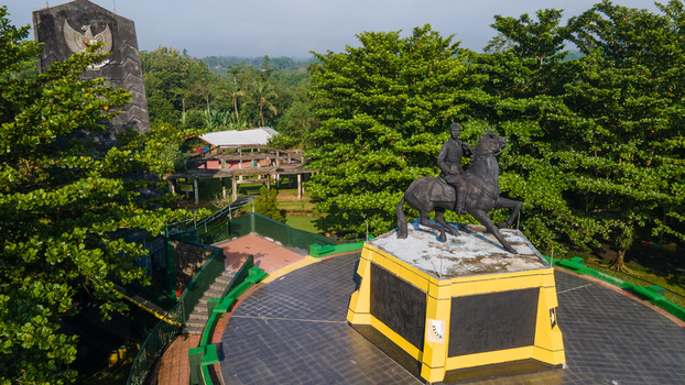 Purwokerto Indonesia 08 May 2026 Aerial view of the National Monument of Jendral Soedirman featuring the equestrian statue surrounded by lush greenery and a stone wall. Purwokerto Indonesia 08 May 2026 Aerial view of the National Monument of Jendral Soedirman featuring the equestrian statue surrounded by lush greenery and a stone wall.