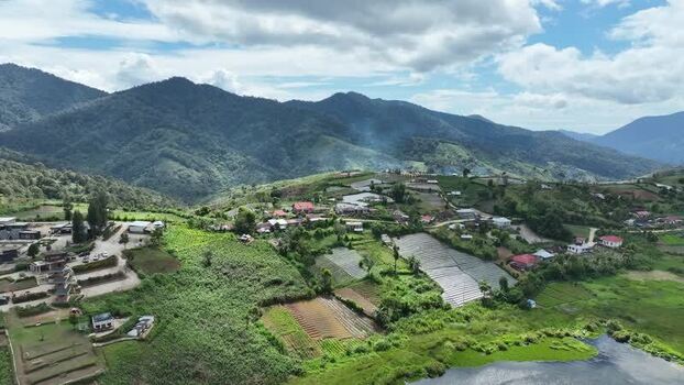 Aerial view of Alahan Panjang village and mountains Indonesia. Aerial view of Alahan Panjang village and mountains Indonesia.