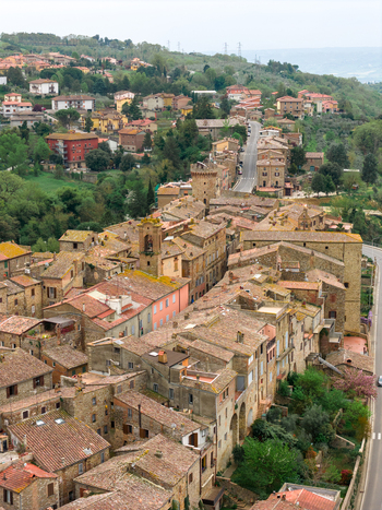 Aerial view of the historic stone buildings and terracotta rooftops of the medieval village surrounded by lush green hills Ficulle Umbria Italy. Aerial view of the historic stone buildings and terracotta rooftops of the medieval village surrounded by lush green hills Ficulle Umbria Italy.