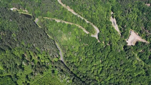 Aerial view of a winding forest road near Selestat France.
