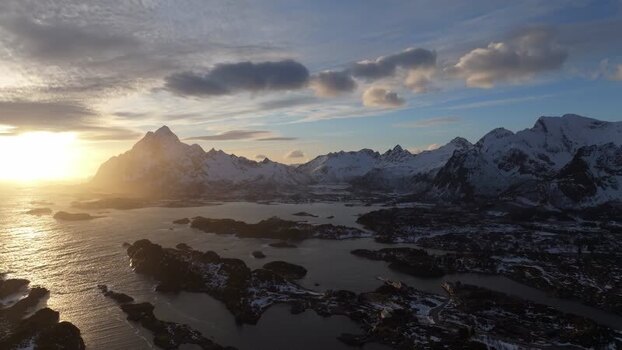 Aerial view of Lofoten mountains at sunset in Norway.