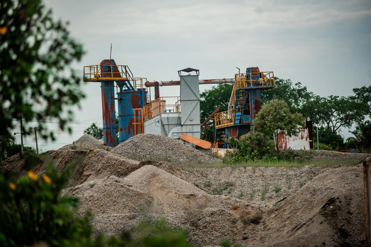 View of industrial stone crushing machinery and piles of gravel at a mining site in Jos North Plateau Nigeria. View of industrial stone crushing machinery and piles of gravel at a mining site in Jos North Plateau Nigeria.
