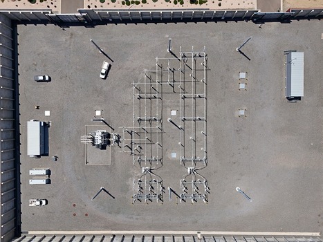 Aerial view of an electrical substation with transformers and electrical equipment on a gravel lot in Thornton Colorado United States. Aerial view of an electrical substation with transformers and electrical equipment on a gravel lot in Thornton Colorado United States.