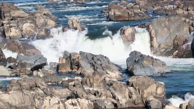 View of Great Falls Park waterfalls cascading over jagged rocks United States. View of Great Falls Park waterfalls cascading over jagged rocks United States.