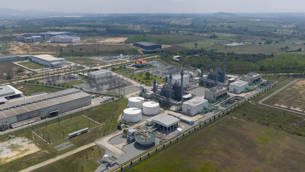 Aerial view of the Amata B.Grimm Power Rayong 3 Ltd. facility with storage tanks and electrical substations in Tambon Mapyangphon Chang Wat Rayong Thailand. Aerial view of the Amata B.Grimm Power Rayong 3 Ltd. facility with storage tanks and electrical substations in Tambon Mapyangphon Chang Wat Rayong Thailand.