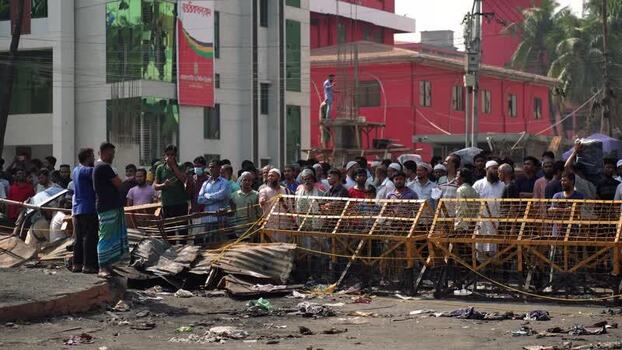 View of a large crowd gathered behind barriers in Dhaka Bangladesh. View of a large crowd gathered behind barriers in Dhaka Bangladesh.