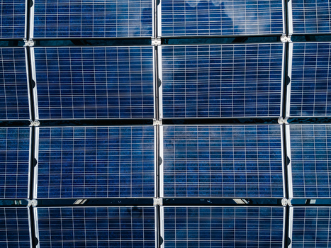 Aerial view of the SolarSea floating solar power plant with blue photovoltaic panels reflecting the sky in Dharavandhoo Baa Atoll Maldives. Aerial view of the SolarSea floating solar power plant with blue photovoltaic panels reflecting the sky in Dharavandhoo Baa Atoll Maldives.