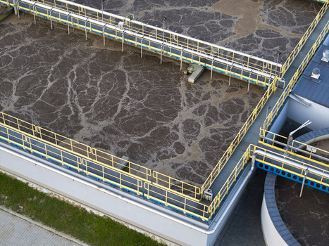 Aerial view of the Dobczyce Wastewater Treatment Plant showing aeration tanks with bubbling water metal walkways and industrial infrastructure in Dobczyce Lesser Poland Voivode Poland.