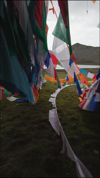 View of colorful prayer flags at Yamdrok Lake China.