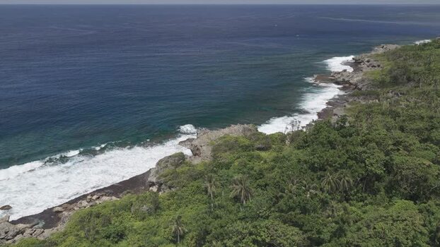 Aerial view of the rocky coastline of Siargao Island Philippines.
