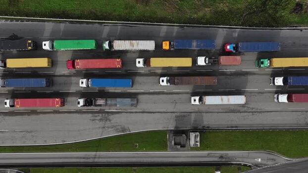 Aerial view of trucks with colorful shipping containers Portugal.