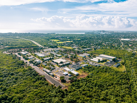 Aerial view of Base de Infanteria de Marina Valm. Manuel Ramon Montes Arache surrounded by lush greenery and industrial buildings in Boca Chica Santo Domingo Dominican Republic. Aerial view of Base de Infanteria de Marina Valm. Manuel Ramon Montes Arache surrounded by lush greenery and industrial buildings in Boca Chica Santo Domingo Dominican Republic.