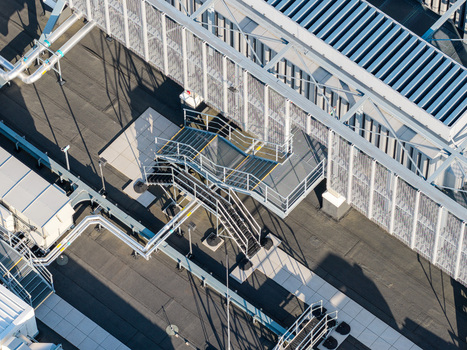 Aerial view of the rooftop of Vantage Data Centers BER1 featuring industrial HVAC equipment metal staircases and ventilation systems in Ludwigsfelde Brandenburg Germany. Aerial view of the rooftop of Vantage Data Centers BER1 featuring industrial HVAC equipment metal staircases and ventilation systems in Ludwigsfelde Brandenburg Germany.