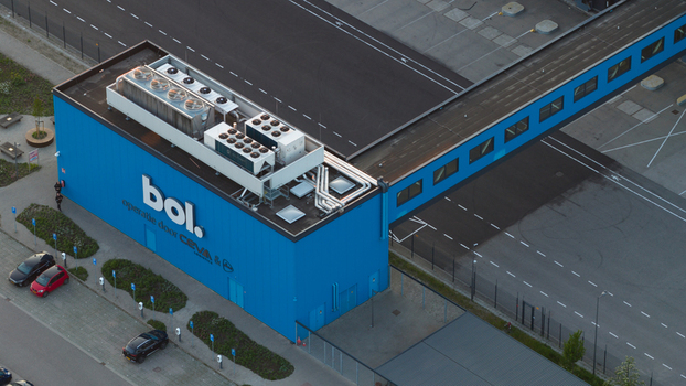Waalwijk Netherlands 09 May 2026 Aerial view of the Bol. distribution center with its distinctive blue facade rooftop ventilation systems and an elevated walkway. Waalwijk Netherlands 09 May 2026 Aerial view of the Bol. distribution center with its distinctive blue facade rooftop ventilation systems and an elevated walkway.