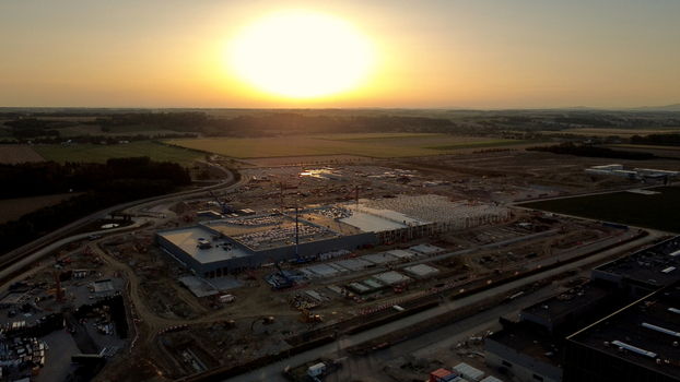 Aerial view of a data center construction site with heavy machinery and building structures in the countryside at sunset in Kronstorf Upper Austria Austria. Aerial view of a data center construction site with heavy machinery and building structures in the countryside at sunset in Kronstorf Upper Austria Austria.