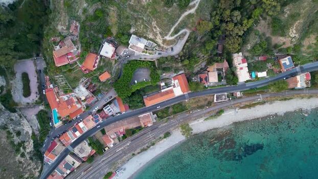 Aerial view of coastal houses and railway in Taormina Italy. Aerial view of coastal houses and railway in Taormina Italy.