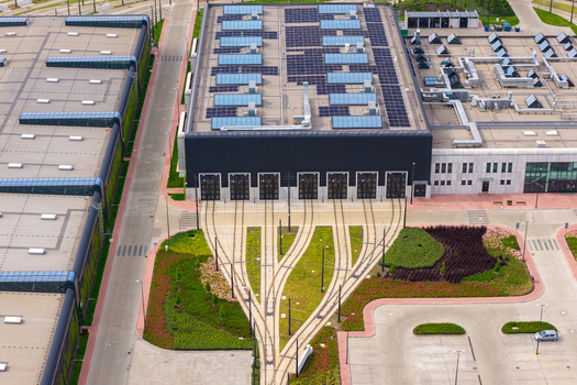 Aerial view of Zajezdnia Annopol 01 tram depot with modern industrial architecture solar panels and tram tracks leading into the facility in Warsaw Masovian Voivodeship Poland. Aerial view of Zajezdnia Annopol 01 tram depot with modern industrial architecture solar panels and tram tracks leading into the facility in Warsaw Masovian Voivodeship Poland.