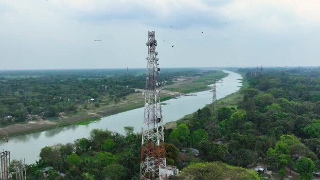 Aerial view of a telecommunication tower by a river. Aerial view of a telecommunication tower by a river.