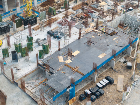 Bukit Tambun Penang Malaysia 25 September 2026 Aerial view of a construction area with concrete foundations steel rebar formwork panels and heavy equipment. Bukit Tambun Penang Malaysia 25 September 2026 Aerial view of a construction area with concrete foundations steel rebar formwork panels and heavy equipment.
