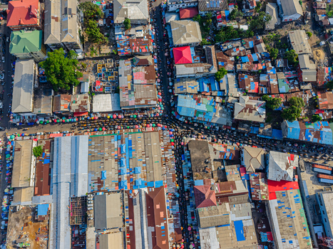 Aerial view of a dense urban market area with colorful rooftops and crowded streets in Monrovia Montserrado Liberia. Aerial view of a dense urban market area with colorful rooftops and crowded streets in Monrovia Montserrado Liberia.
