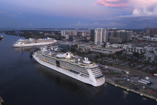 Tampa Florida United States 04 July 2026 Aerial view of Tampa Cruise Terminal 6 with cruise ships docked along the waterfront and modern city skyline under a soft sunset sky.