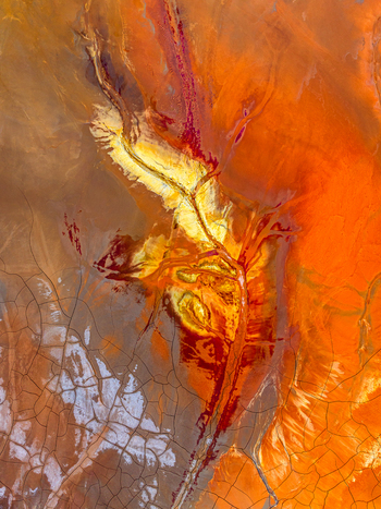 Aerial view of vibrant mineral deposits and cracked earth patterns in the landscape of Andalusia Spain. Aerial view of vibrant mineral deposits and cracked earth patterns in the landscape of Andalusia Spain.